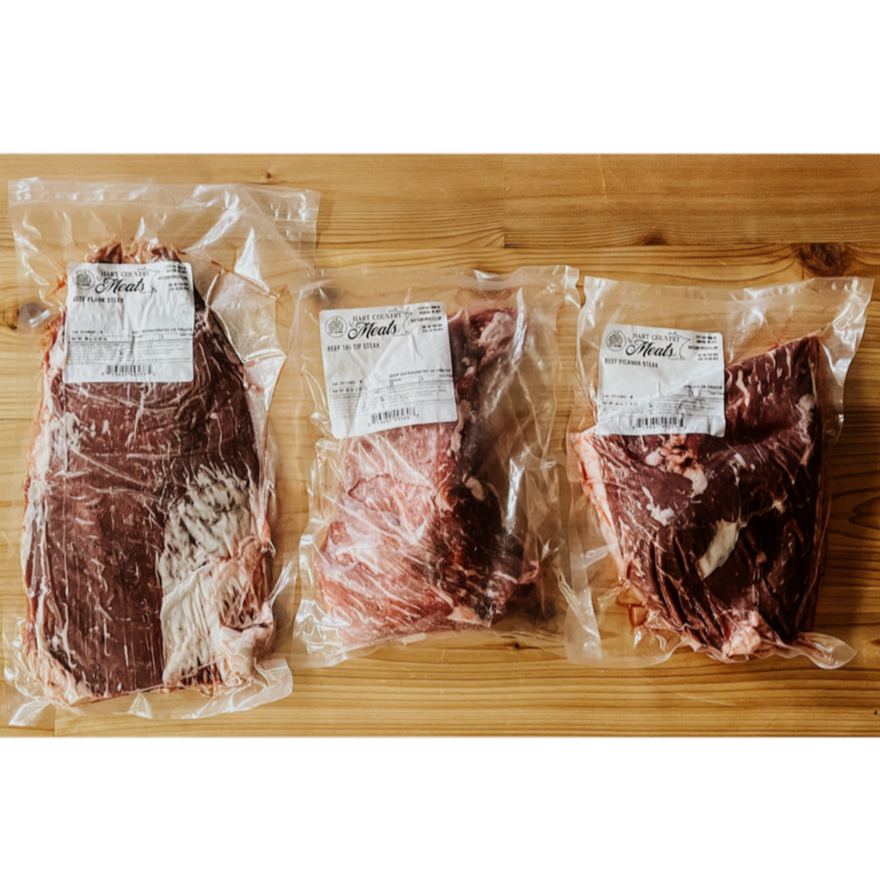 The contents of the Carne Collection from Hart Country Meats consisting of flank steak, tri tip, and picanha steak.