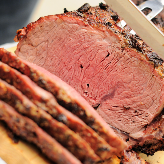 A shot of sliced prime rib, the contents of the Elegant Prime Rib Dinner Box from Hart Country Meats