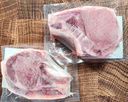 Contents of the Thick-Cut Iowa Chops Box from Hart Country Meats, consisting of 4 2-inch thick, bone-in pork chops.