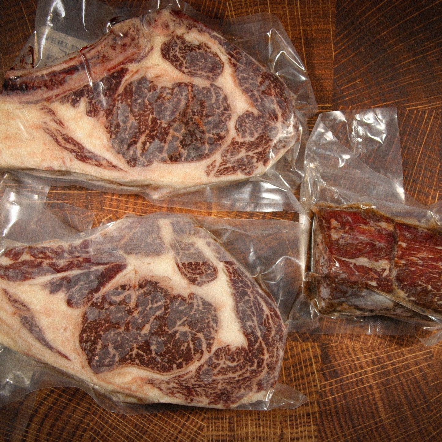 Contents of the American Wagyu Filets & Ribeyes from Verlinde Farms, consisting of 2 bone-in American Wagyu ribeyes, and 2 American Wagyu filets.