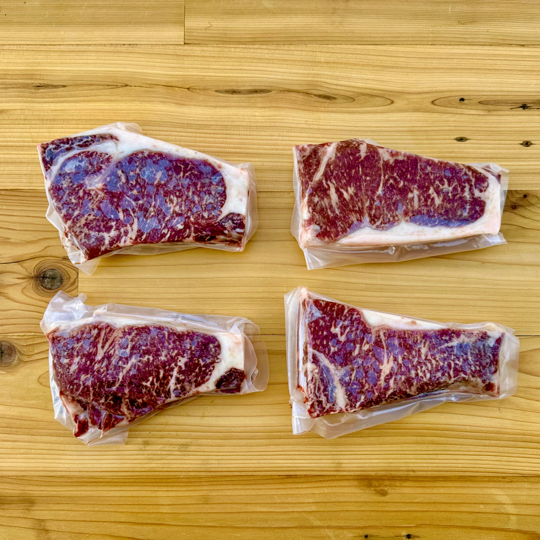 The American Wagyu New York Strip Steaks box from Verlinde Farms, consisting of your choice of 2 or 4 American Wagyu New York Strip Steaks.